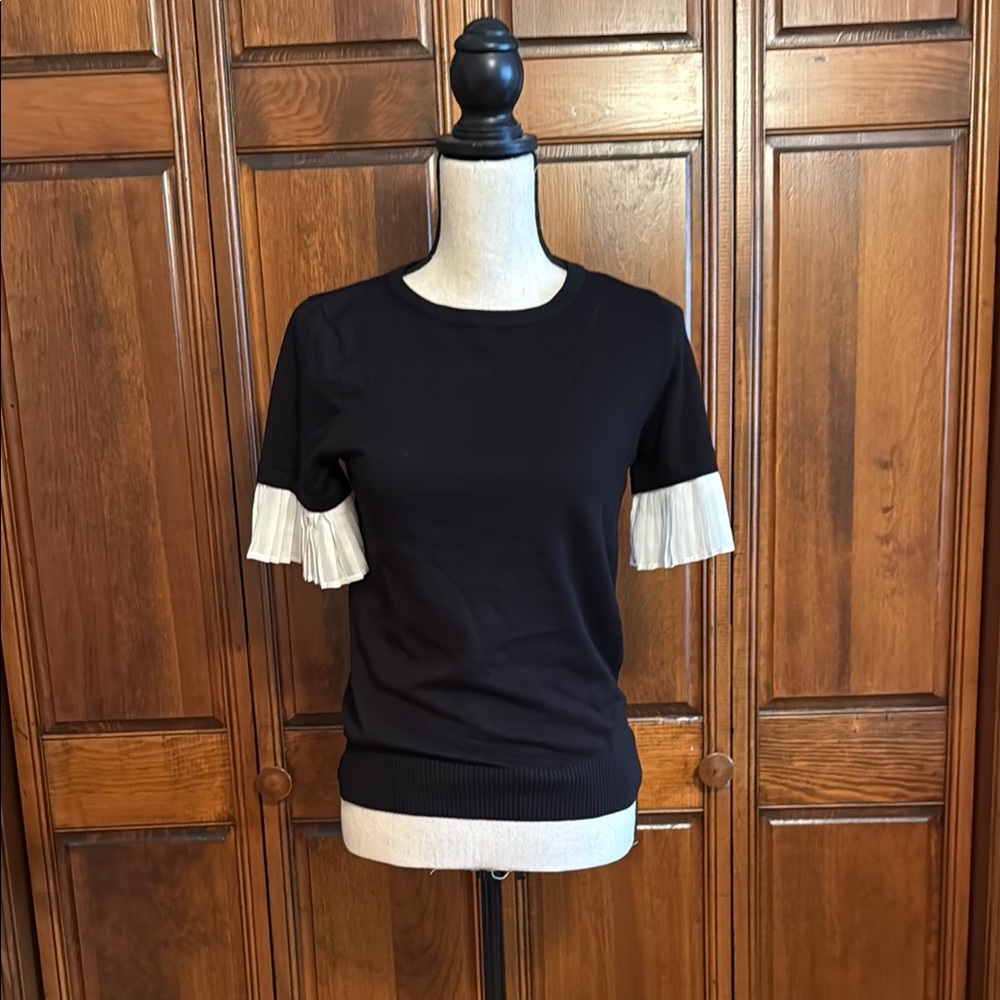 Elegant Black Top with White Accents